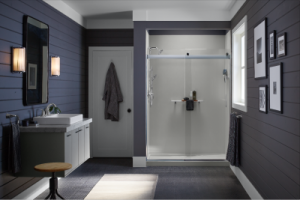A bathroom with purple walls and a walk-in shower with a white surround