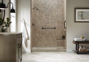 A large bathroom showcasing a walk-in shower equipped with safety features, such as grab bars